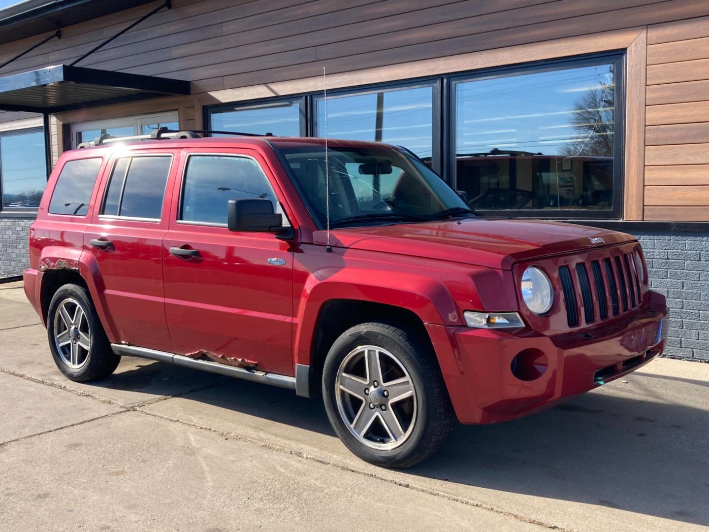 2009 Chili Pepper Me Jeep Patriot Sport 4WD (1J4FF28B49D) with an 2.4L L4 DOHC 16V engine, located at 1800 South Ihm Blvd, Freeport, IL, 61032, (815) 232-5543, 42.278645, -89.607994 - Patriot Sport 4D SUV 4WD - Photo#0