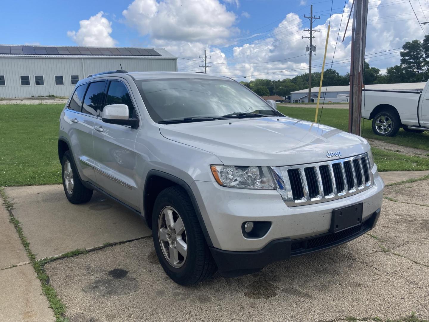 2012 Silver Met Jeep Grand Cherokee Laredo 4WD (1C4RJFAG1CC) with an 3.6L V6 DOHC 24V engine, 5-Speed Automatic transmission, located at 1800 South Ihm Blvd, Freeport, IL, 61032, (815) 232-5543, 42.278645, -89.607994 - Grand Cherokee Laredo 4D SUV 4WD - Photo#0