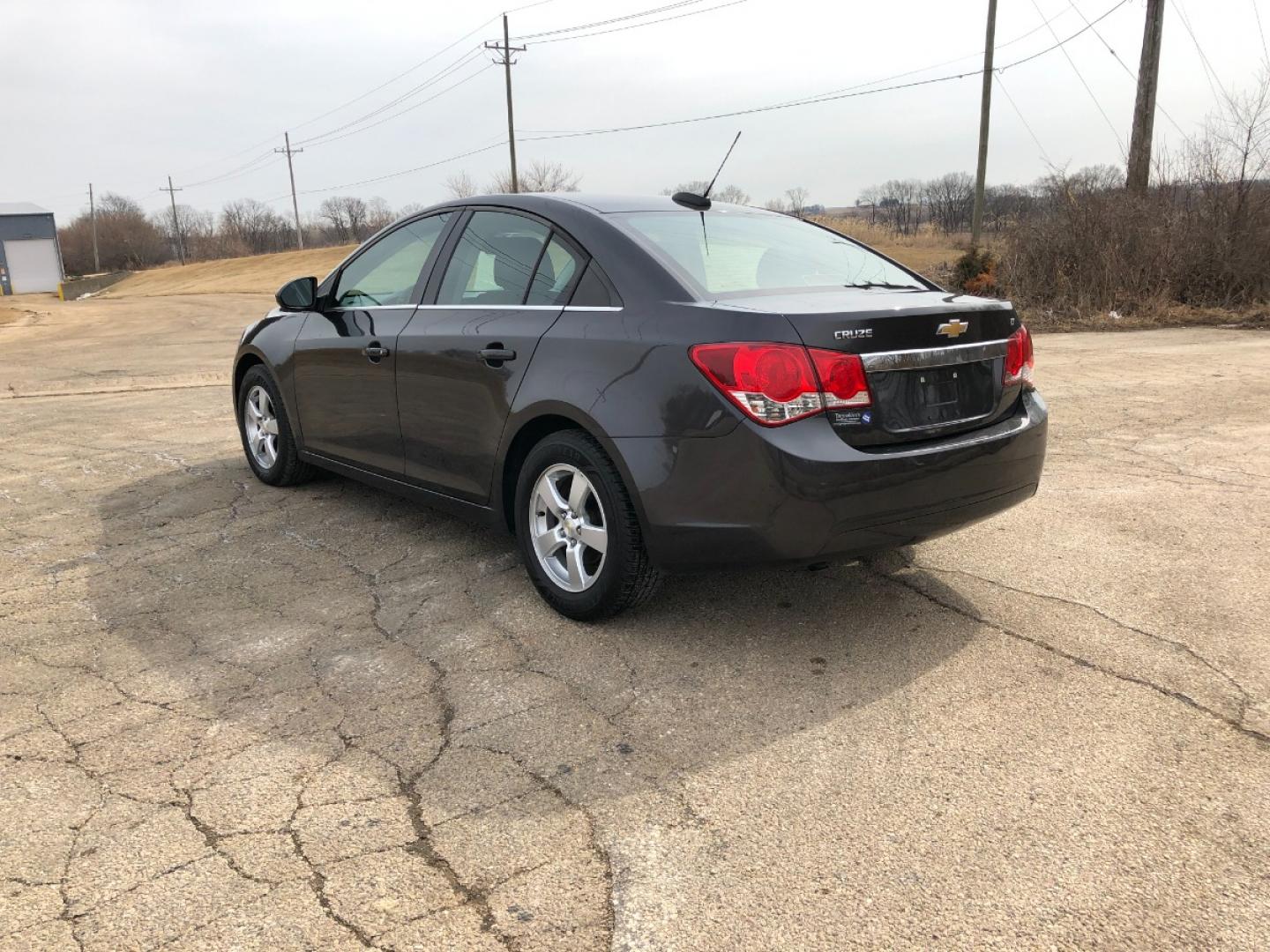 2015 Dark Graphite M Chevrolet Cruze 1LT Auto (1G1PC5SBXF7) with an 1.4L L4 DOHC 16V TURBO engine, 6-Speed Automatic transmission, located at 1800 South Ihm Blvd, Freeport, IL, 61032, (815) 232-5543, 42.278645, -89.607994 - Photo#1