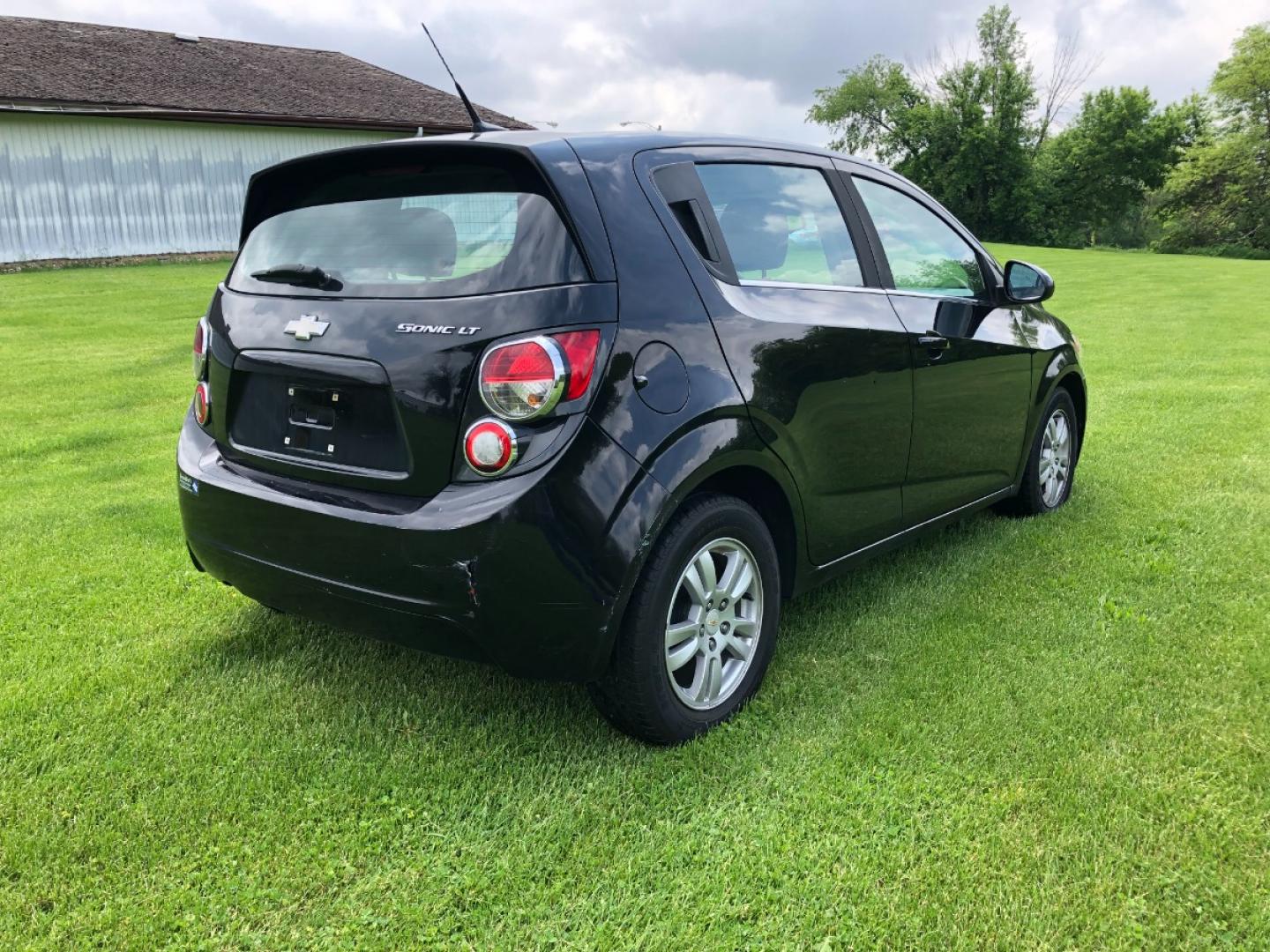 2012 Black Chevrolet Sonic 2LT 5-Door (1G1JC6SH2C4) with an 1.8L L4 DOHC 24V FFV engine, 6-Speed Automatic transmission, located at 1800 South Ihm Blvd, Freeport, IL, 61032, (815) 232-5543, 42.278645, -89.607994 - Photo#2