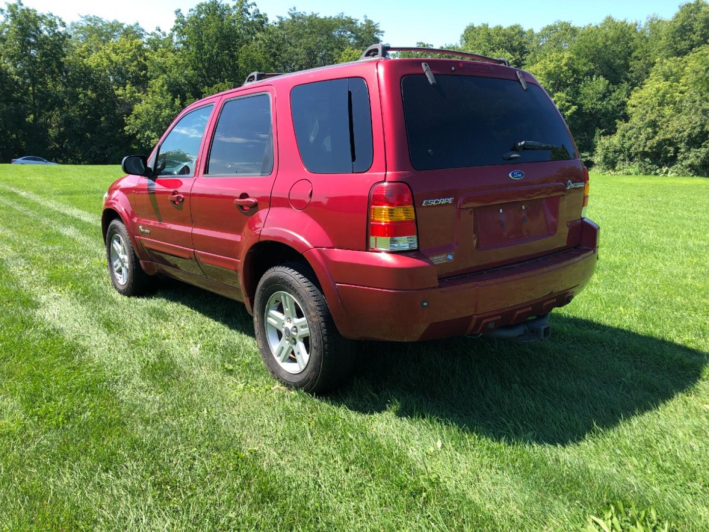 2006 Redfire Met Ford Escape Hybrid FWD (1FMCU95HX6K) with an 2.3L L4 DOHC 16V HYBRID engine, Automatic CVT Overdrive transmission, located at 1800 South Ihm Blvd, Freeport, IL, 61032, (815) 232-5543, 42.278645, -89.607994 - Photo#1