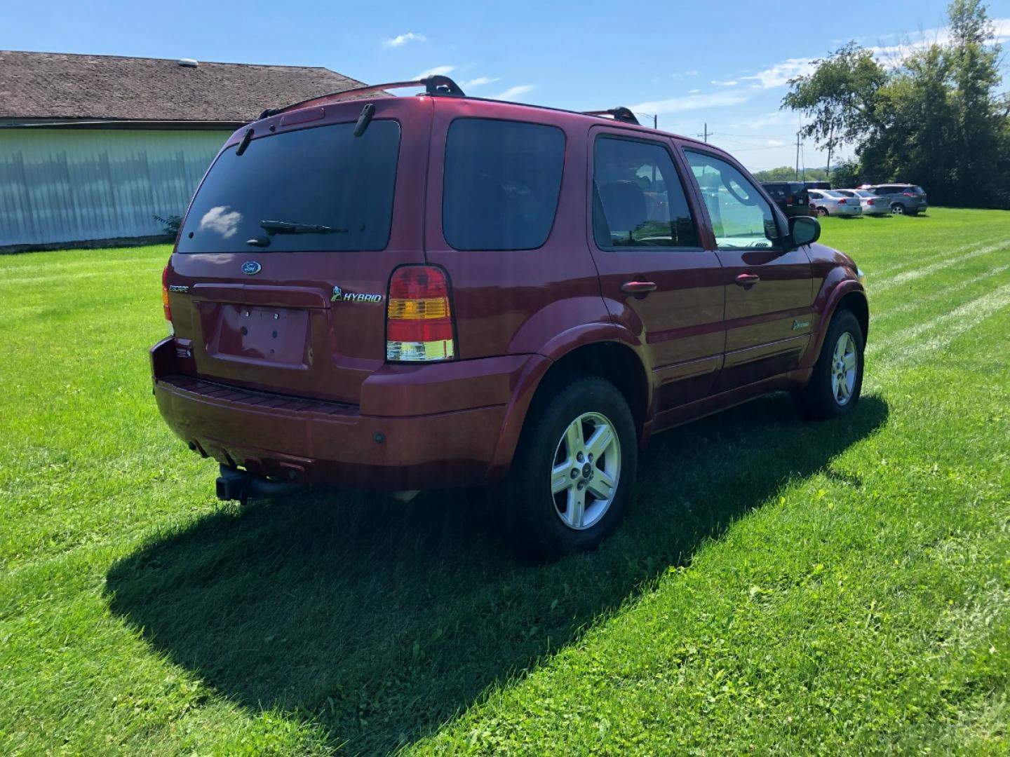 2006 Redfire Met Ford Escape Hybrid FWD (1FMCU95HX6K) with an 2.3L L4 DOHC 16V HYBRID engine, Automatic CVT Overdrive transmission, located at 1800 South Ihm Blvd, Freeport, IL, 61032, (815) 232-5543, 42.278645, -89.607994 - Photo#2