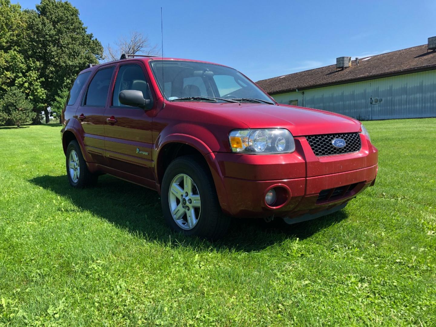 2006 Redfire Met Ford Escape Hybrid FWD (1FMCU95HX6K) with an 2.3L L4 DOHC 16V HYBRID engine, Automatic CVT Overdrive transmission, located at 1800 South Ihm Blvd, Freeport, IL, 61032, (815) 232-5543, 42.278645, -89.607994 - Photo#3