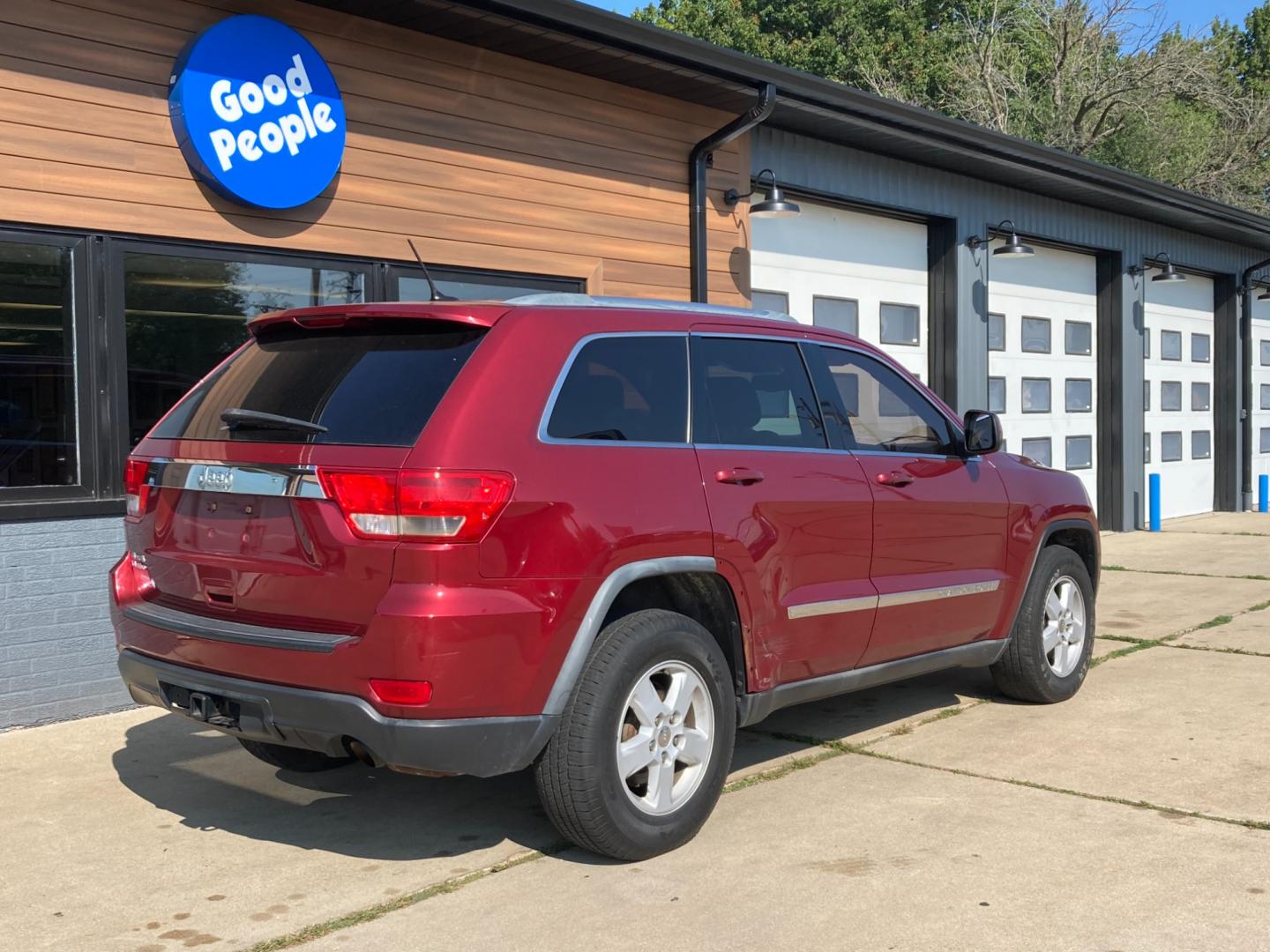 2012 Ruby Red Met Jeep Grand Cherokee Laredo 4WD (1C4RJFAG4CC) with an 3.6L V6 DOHC 24V engine, 5-Speed Automatic transmission, located at 1800 South Ihm Blvd, Freeport, IL, 61032, (815) 232-5543, 42.278645, -89.607994 - Grand Cherokee Laredo 4D SUV 4WD - Photo#1