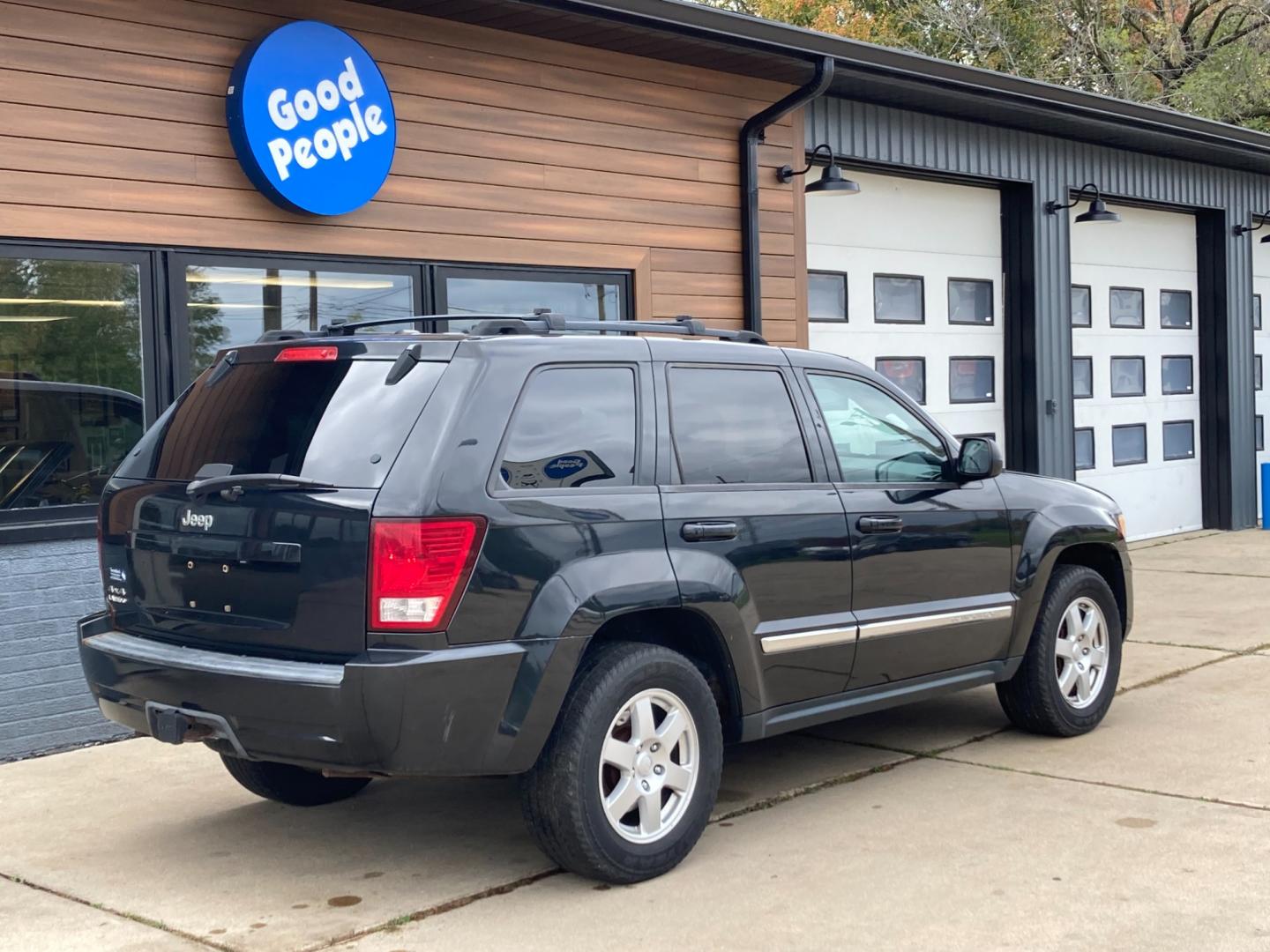 2010 Black Met Jeep Grand Cherokee Laredo 4WD (1J4PR4GK6AC) with an 3.7L V6 SOHC 12V engine, 5-Speed Automatic transmission, located at 1800 South Ihm Blvd, Freeport, IL, 61032, (815) 232-5543, 42.278645, -89.607994 - Photo#1