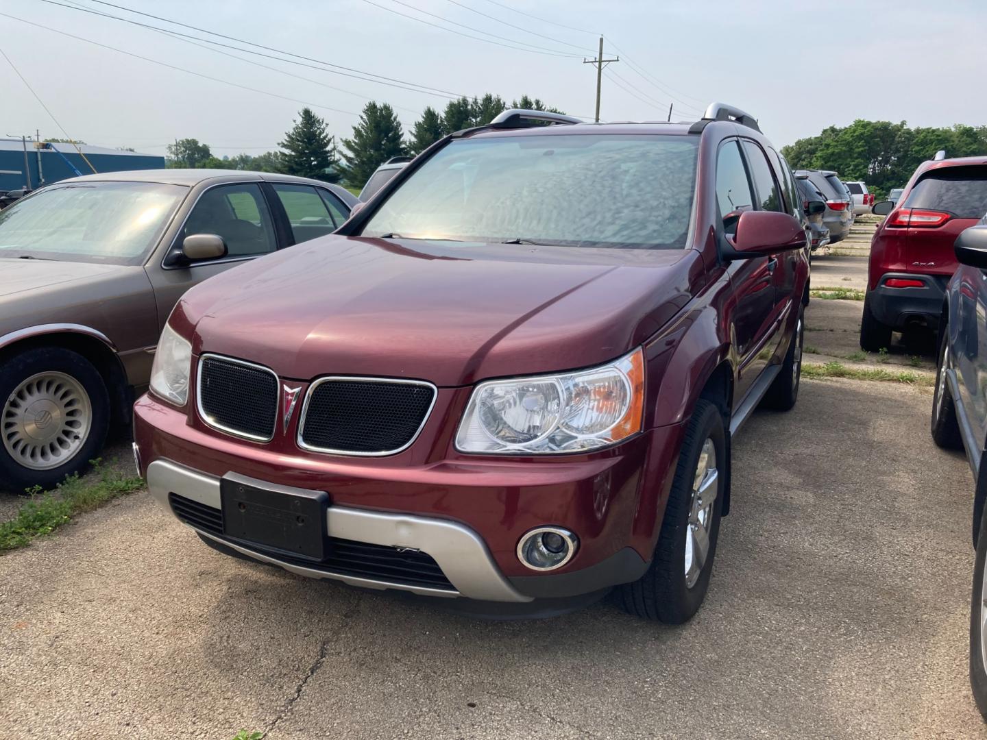 2008 Ruby Red Met Pontiac Torrent AWD (2CKDL43F386) with an 3.4L V6 OHV 12V engine, 5-Speed Automatic transmission, located at 1800 South Ihm Blvd, Freeport, IL, 61032, (815) 232-5543, 42.278645, -89.607994 - Torrent Base 4D SUV AWD - Photo#0