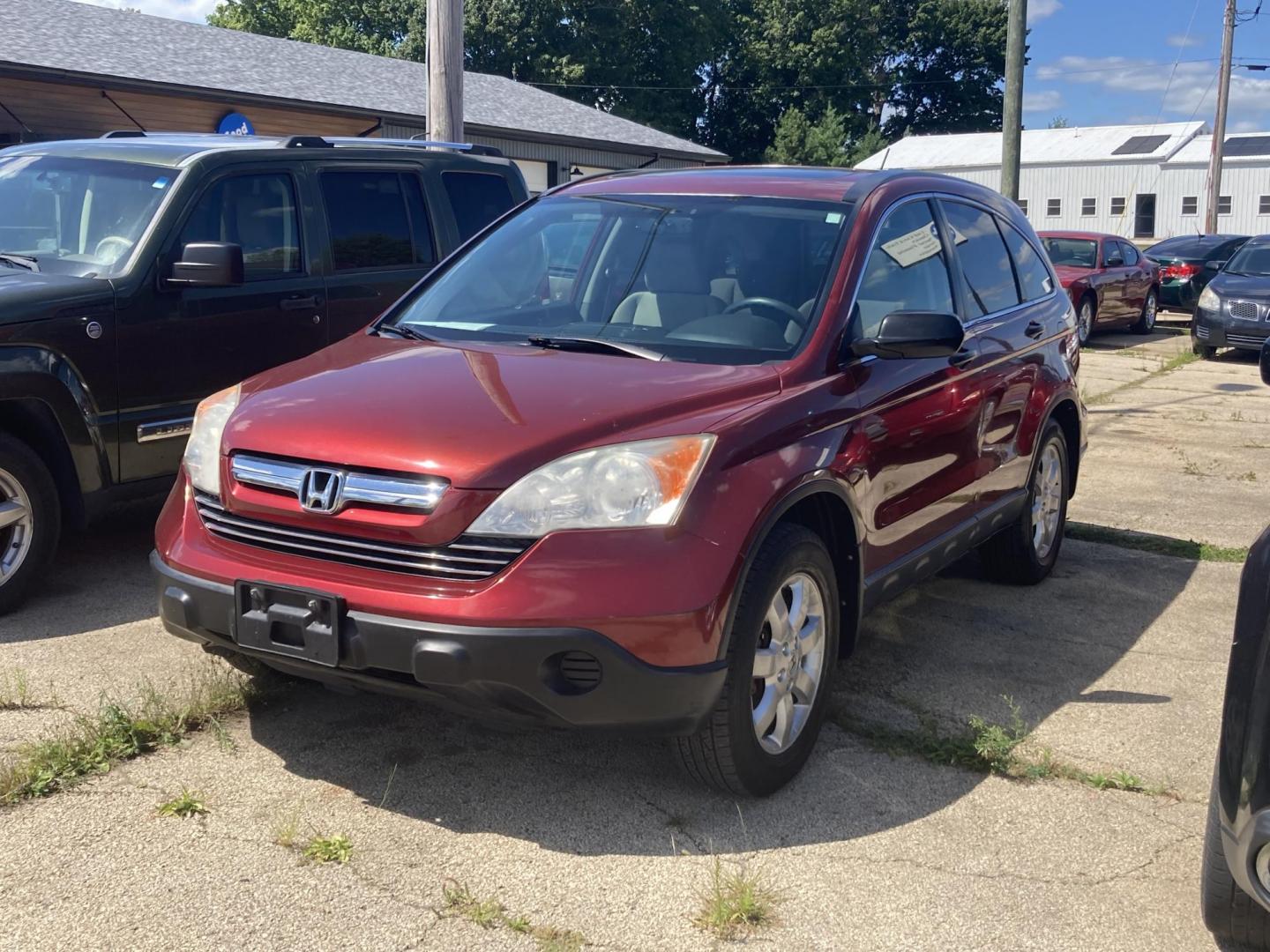 2007 Tango Red Met Honda CR-V EX 4WD AT (JHLRE48527C) with an 2.4L L4 DOHC 16V engine, 5-Speed Automatic Overdrive transmission, located at 1800 South Ihm Blvd, Freeport, IL, 61032, (815) 232-5543, 42.278645, -89.607994 - CR-V EX 4D SUV 4WD - Photo#0