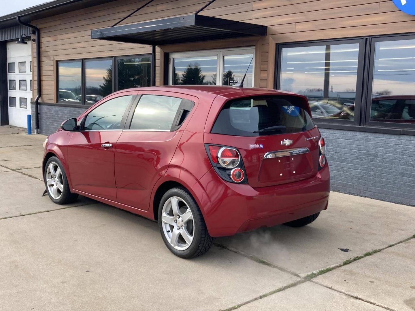 2012 Firethorn Red Met Chevrolet Sonic LTZ 5-Door (1G1JE6SH3C4) with an 1.8L L4 DOHC 24V FFV engine, 6-Speed Automatic transmission, located at 1800 South Ihm Blvd, Freeport, IL, 61032, (815) 232-5543, 42.278645, -89.607994 - Photo#0