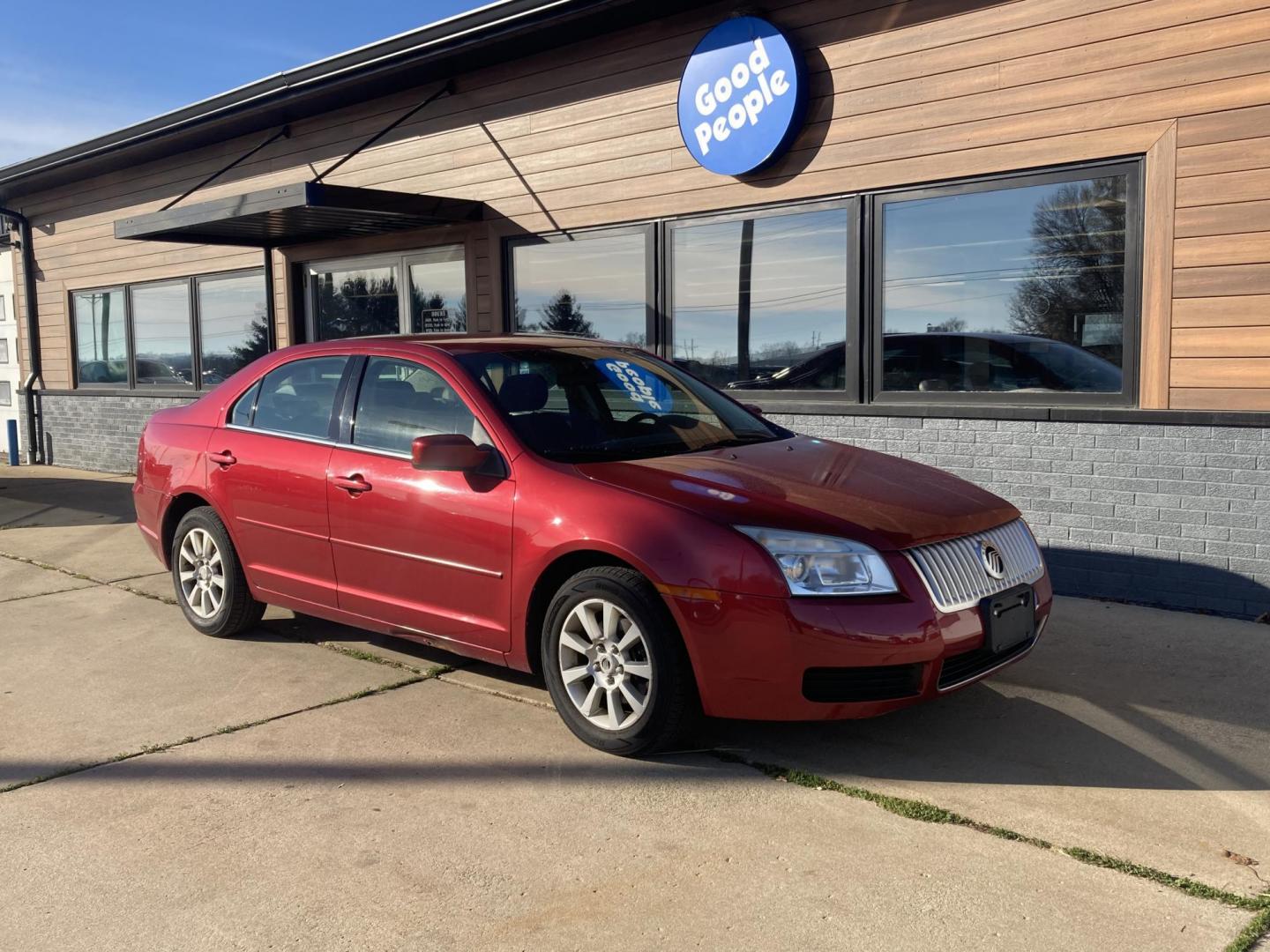 2006 Inferno Red Met Mercury Milan V6 (3MEFM07176R) with an 3.0L V6 DOHC 24V engine, 6-Speed Automatic Overdrive transmission, located at 1800 South Ihm Blvd, Freeport, IL, 61032, (815) 232-5543, 42.278645, -89.607994 - Photo#0