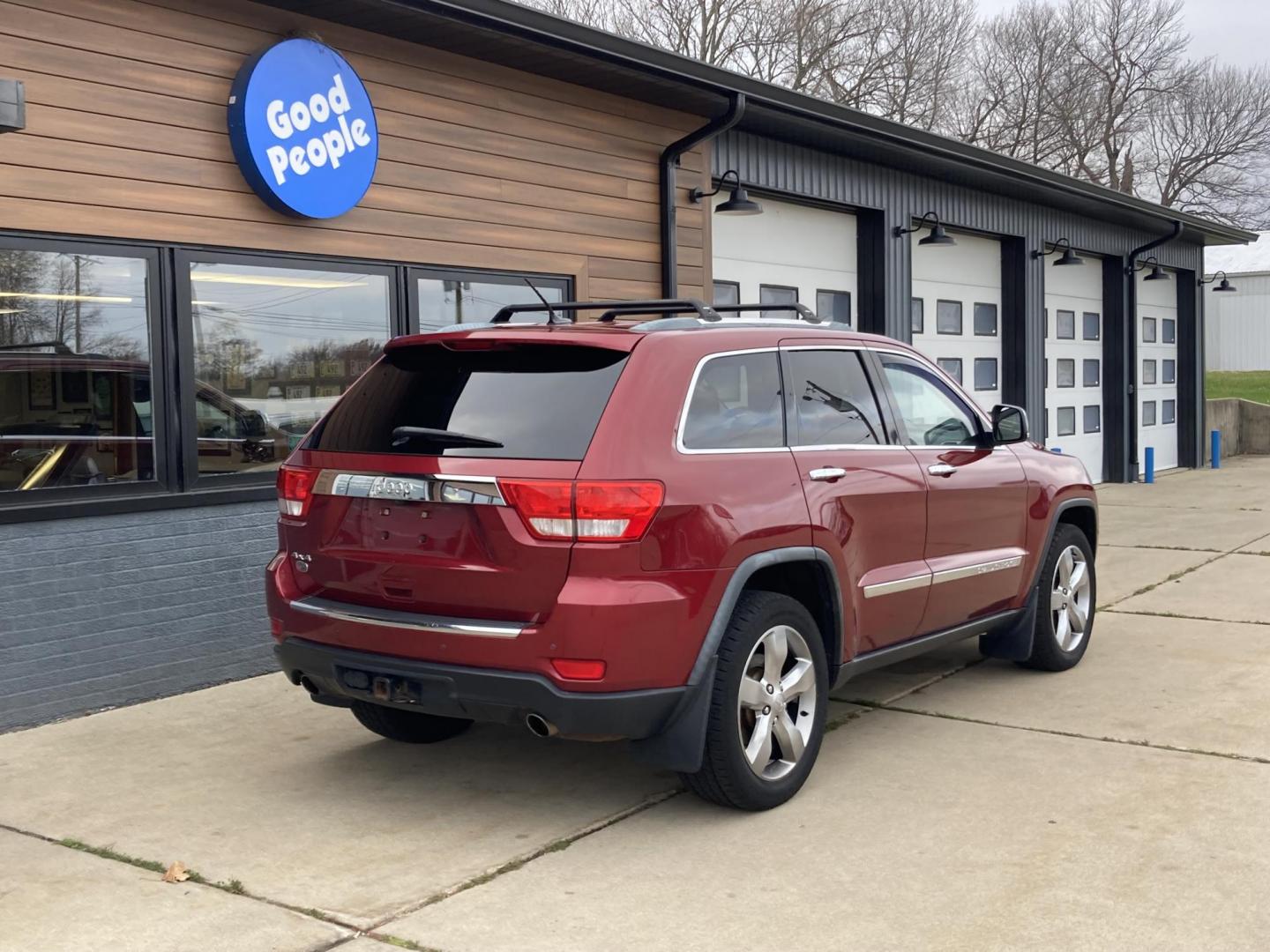 2012 Garnet Red Met. Jeep Grand Cherokee Overland 4WD (1C4RJFCT6CC) with an 5.7L V8 OHV 16V engine, 5-Speed Automatic transmission, located at 1800 South Ihm Blvd, Freeport, IL, 61032, (815) 232-5543, 42.278645, -89.607994 - Grand Cherokee Overland 4D SUV 4WD - Photo#1