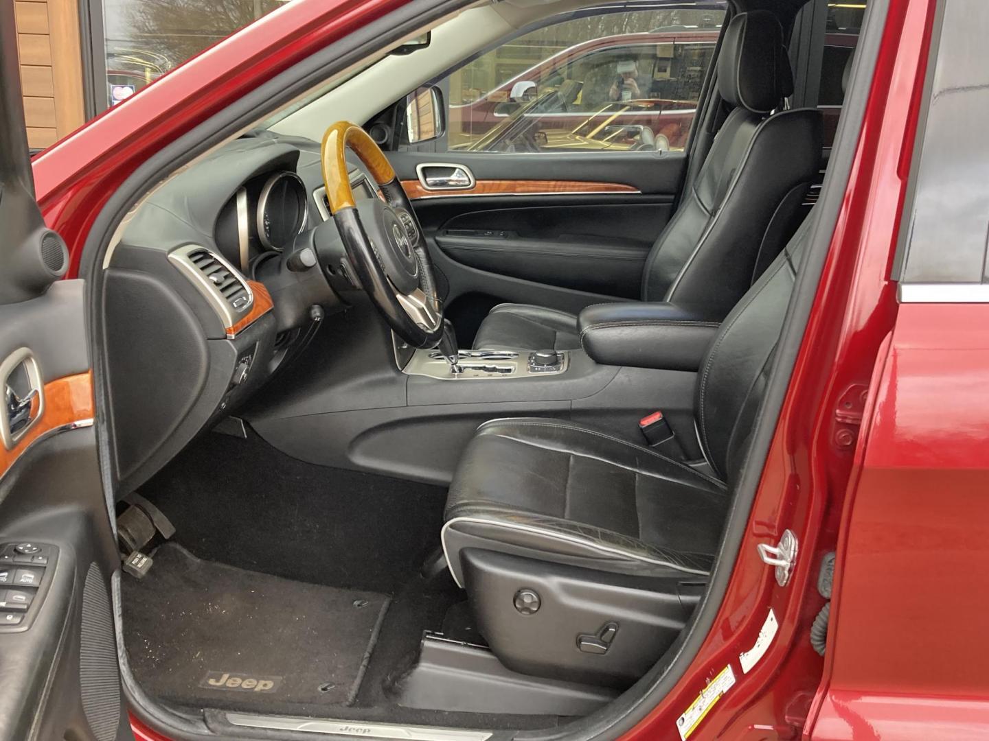 2012 Garnet Red Met. Jeep Grand Cherokee Overland 4WD (1C4RJFCT6CC) with an 5.7L V8 OHV 16V engine, 5-Speed Automatic transmission, located at 1800 South Ihm Blvd, Freeport, IL, 61032, (815) 232-5543, 42.278645, -89.607994 - Grand Cherokee Overland 4D SUV 4WD - Photo#4