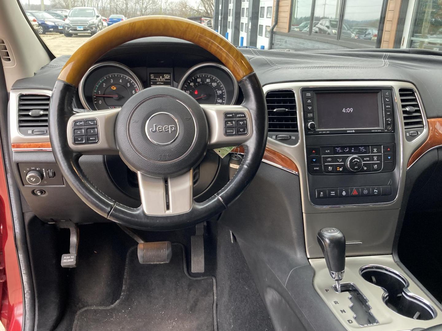 2012 Garnet Red Met. Jeep Grand Cherokee Overland 4WD (1C4RJFCT6CC) with an 5.7L V8 OHV 16V engine, 5-Speed Automatic transmission, located at 1800 South Ihm Blvd, Freeport, IL, 61032, (815) 232-5543, 42.278645, -89.607994 - Grand Cherokee Overland 4D SUV 4WD - Photo#5