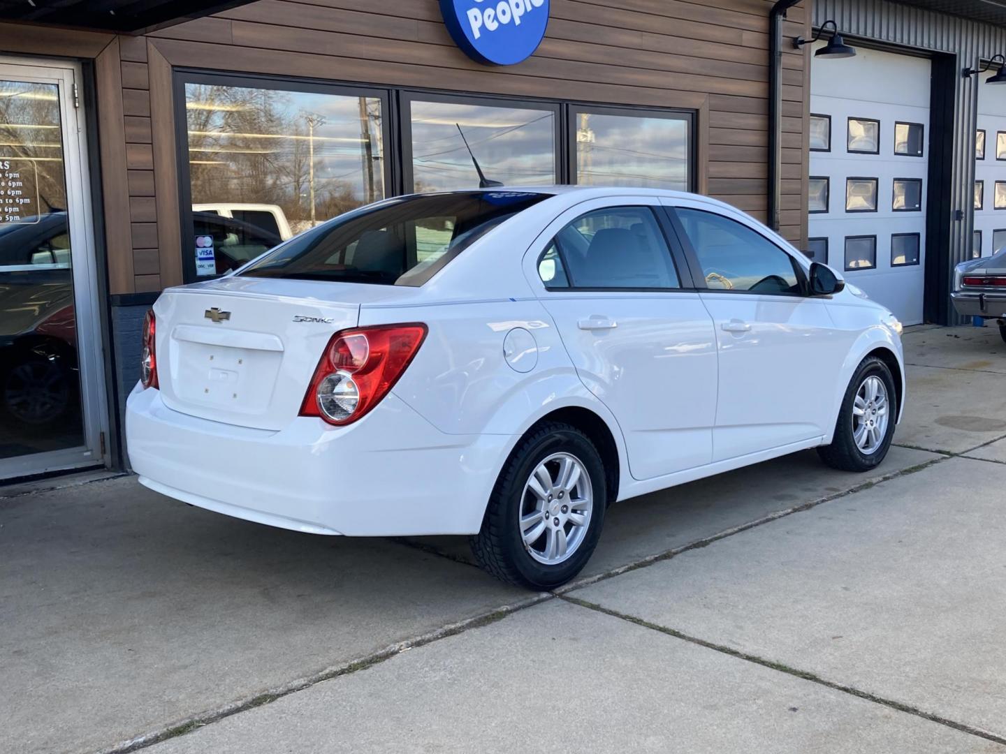 2012 Arctic White Chevrolet Sonic 2LS Sedan (1G1JA5SHXC4) with an 1.8L L4 DOHC 24V FFV engine, 6-Speed Automatic transmission, located at 1800 South Ihm Blvd, Freeport, IL, 61032, (815) 232-5543, 42.278645, -89.607994 - Sonic 2LS 4D Sedan - Photo#1