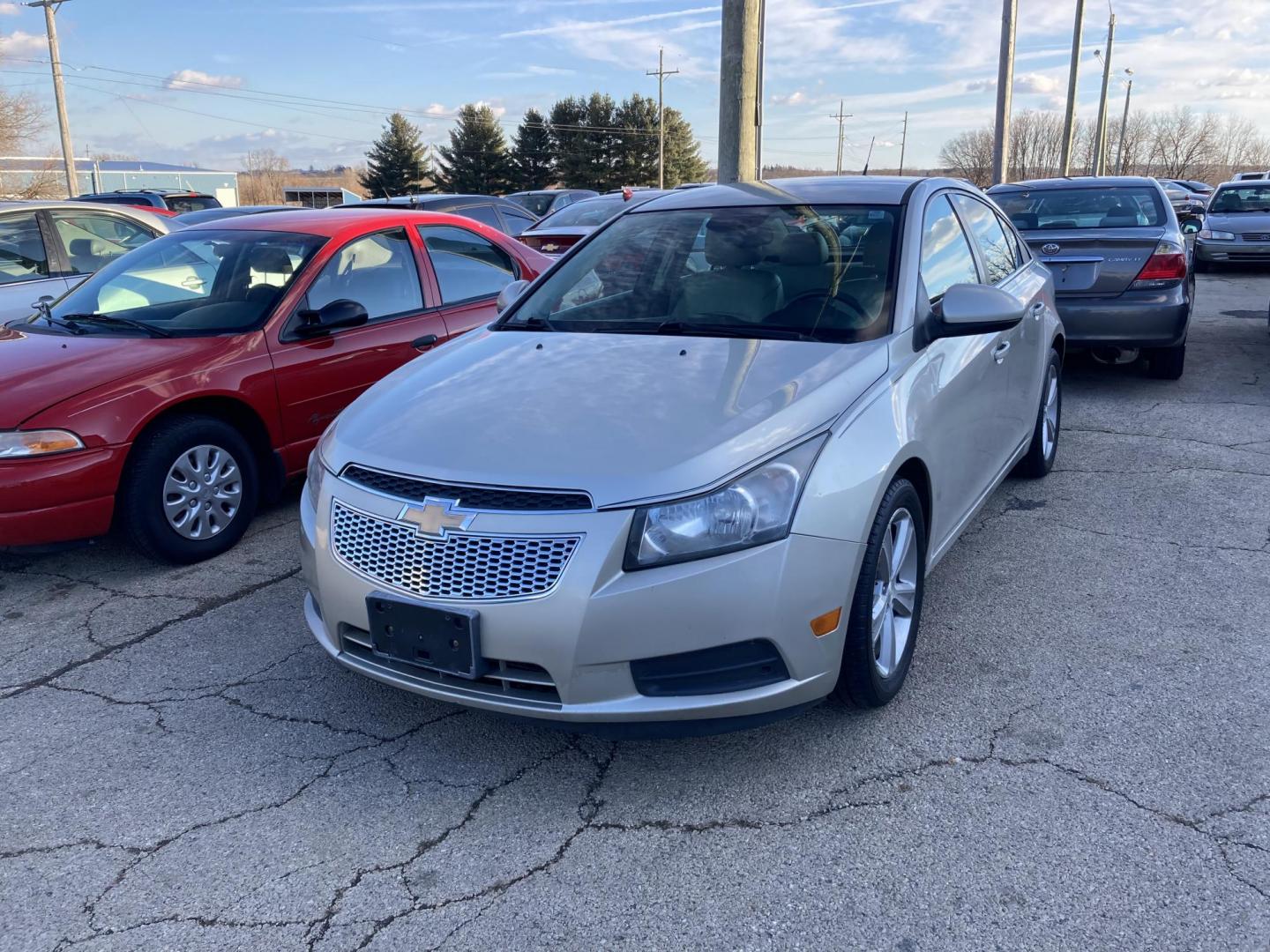 2013 Champagne Met Chevrolet Cruze 2LT Auto (1G1PE5SB9D7) with an 1.4L L4 DOHC 16V TURBO engine, 6-Speed Automatic transmission, located at 1800 South Ihm Blvd, Freeport, IL, 61032, (815) 232-5543, 42.278645, -89.607994 - Cruze LT 4D Sedan - Photo#0