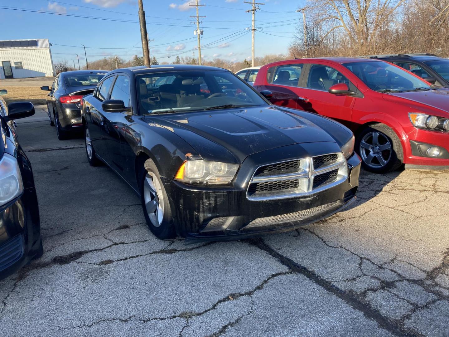 2013 Brilliant Black Met Dodge Charger SE (2C3CDXBG4DH) with an 3.6L V6 DOHC 24V engine, 5-Speed Automatic transmission, located at 1800 South Ihm Blvd, Freeport, IL, 61032, (815) 232-5543, 42.278645, -89.607994 - Photo#0