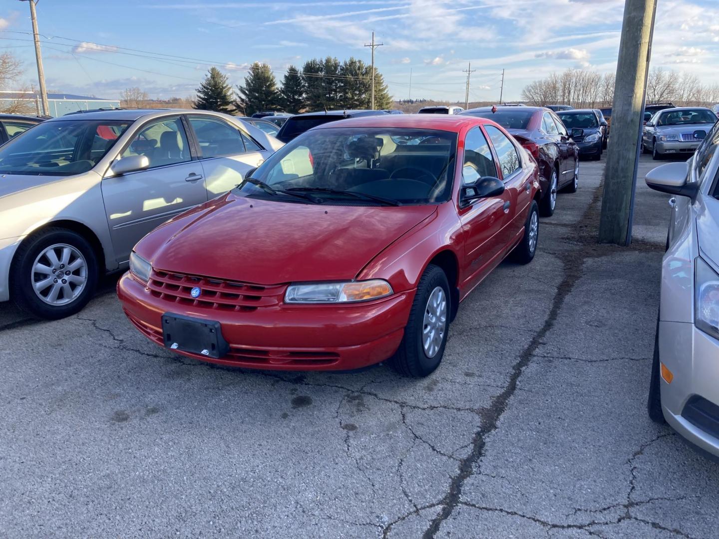 1998 Lipstick Red Plymouth Breeze Base (1P3EJ46X8WN) with an 2.4L L4 DOHC 16V engine, located at 1800 South Ihm Blvd, Freeport, IL, 61032, (815) 232-5543, 42.278645, -89.607994 - Photo#0